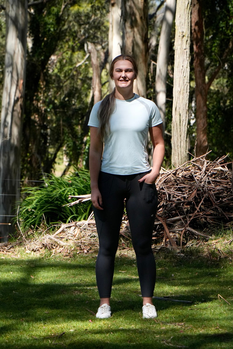 Wilma Sport Sky Blue Technical Fit Tee – lightweight equestrian top with mesh panels with Classic Hybrid Breeches in Slate Grey.