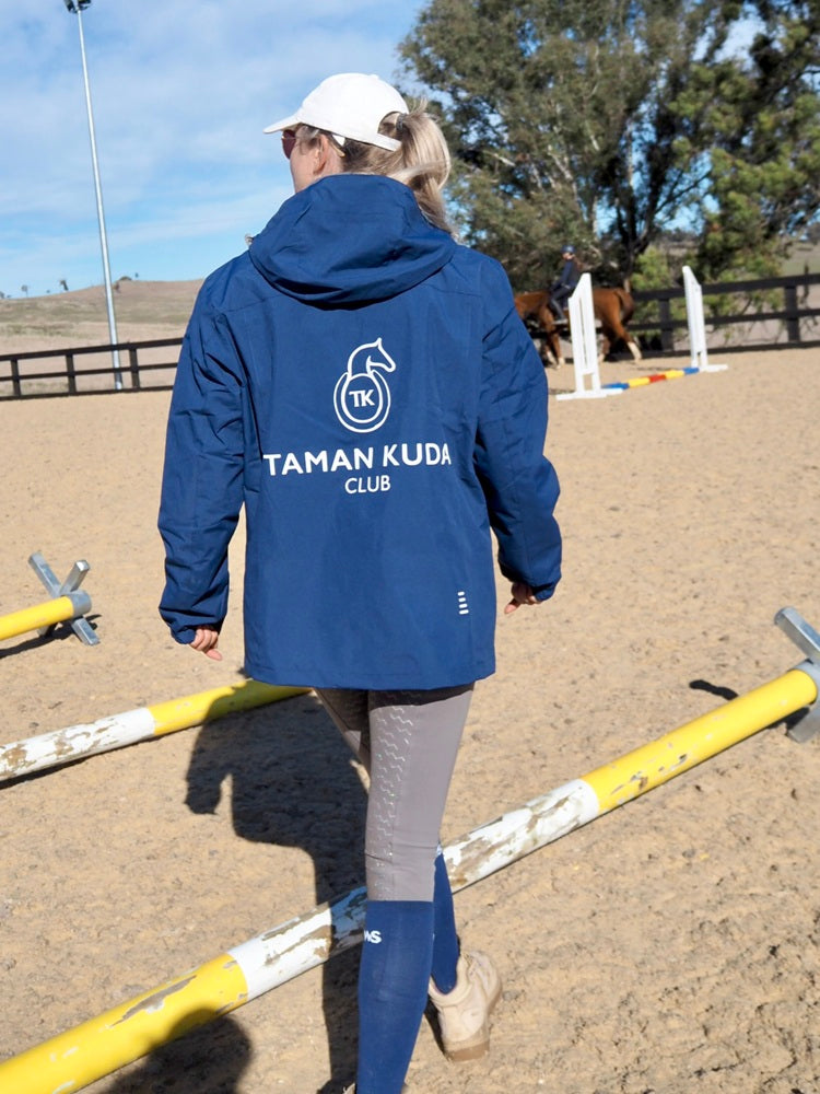 Person wearing Taman Kuda Club 3-in-1 Stable Jacket in Urban Navy, back view
