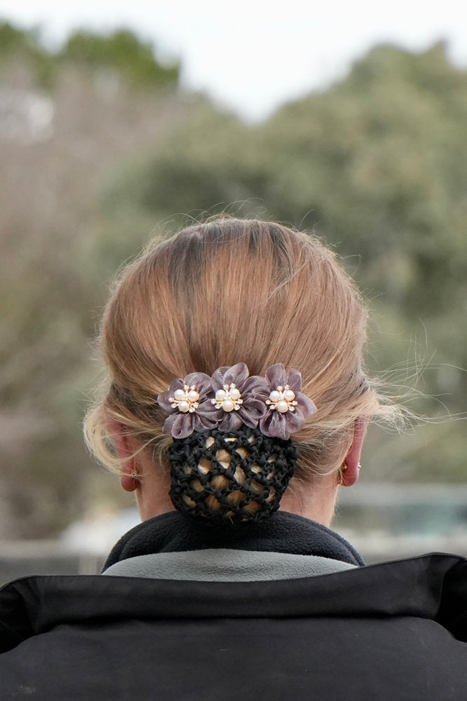 Plum Wilma Sport Pearl Flower Hairnet with flowers, pearls and diamante accents, worn for equestrian competition.